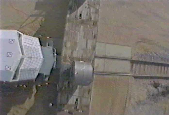 Locomotive approaching coil of steel.